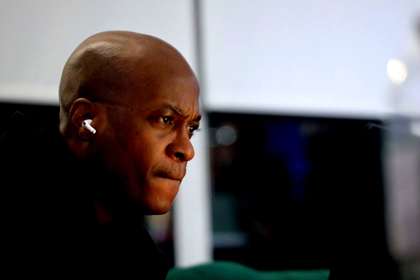 Obed James, Principal and broadcast engineer of James Media Group, focused at a broadcast monitor.